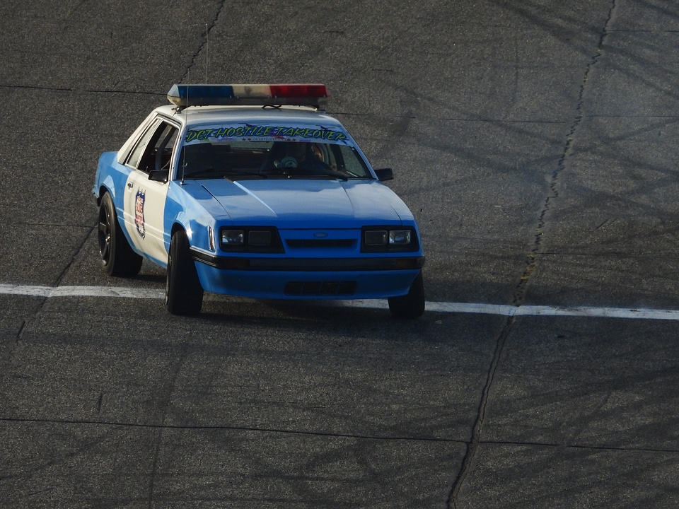 Old police car spinning in turn