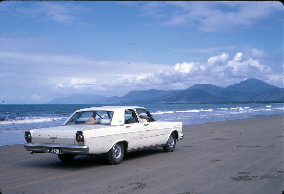 Car driving along the beach
