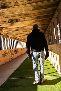Person walking in a tunnel photo