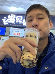 Asian guy drinking Bubble Tea photo