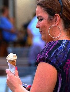 Woman eating ice cream cone photo