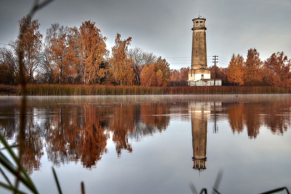 Lighthouse and reflections on the lake