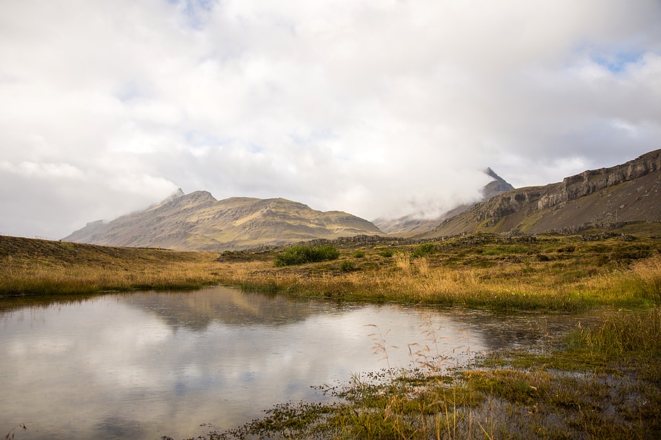 Pond landscape with clouds over the water photo