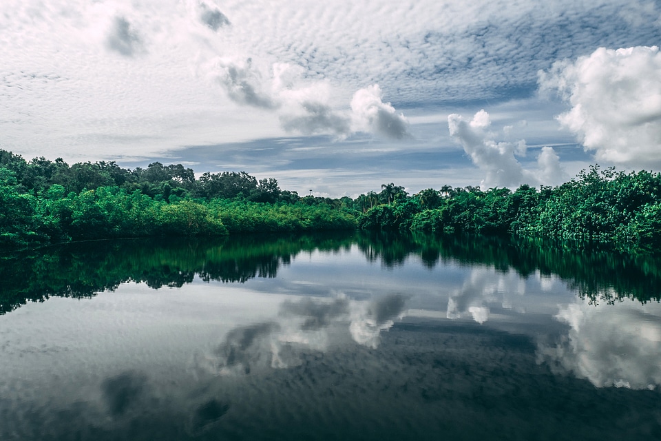 Pond and lake landscape with heavy clouds in the sky