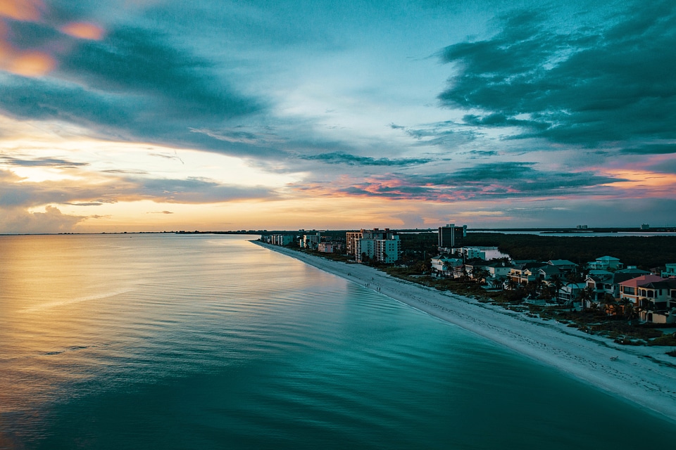 Shoreline nearby a city dusk landscape