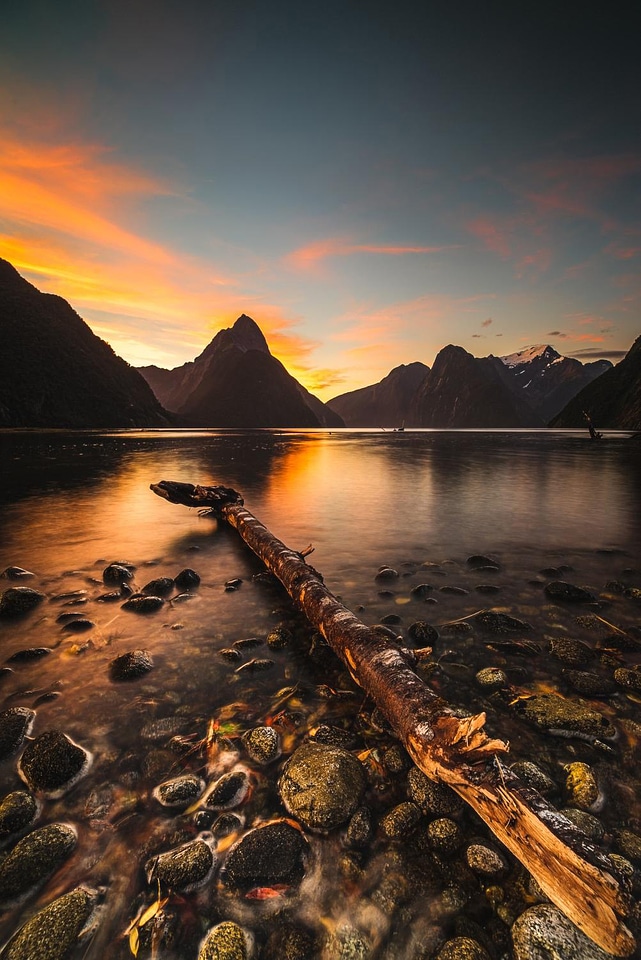 Beautiful landscape with lake and mountains at sunset