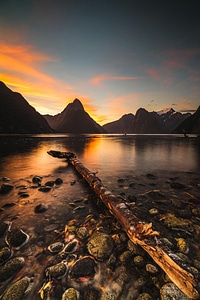 Beautiful landscape with lake and mountains at sunset photo