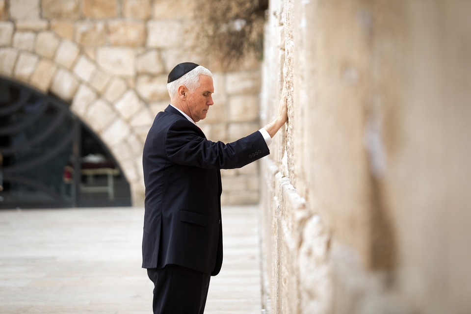 Mike Pence praying on the pray wall