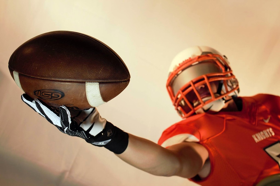 Player Catching Football 