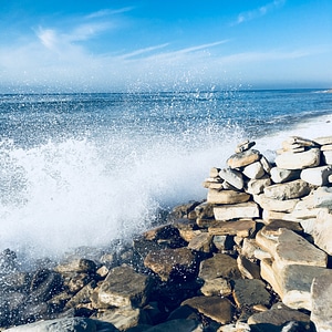 Big Waves Crashing onto rocky shore at King Tide photo