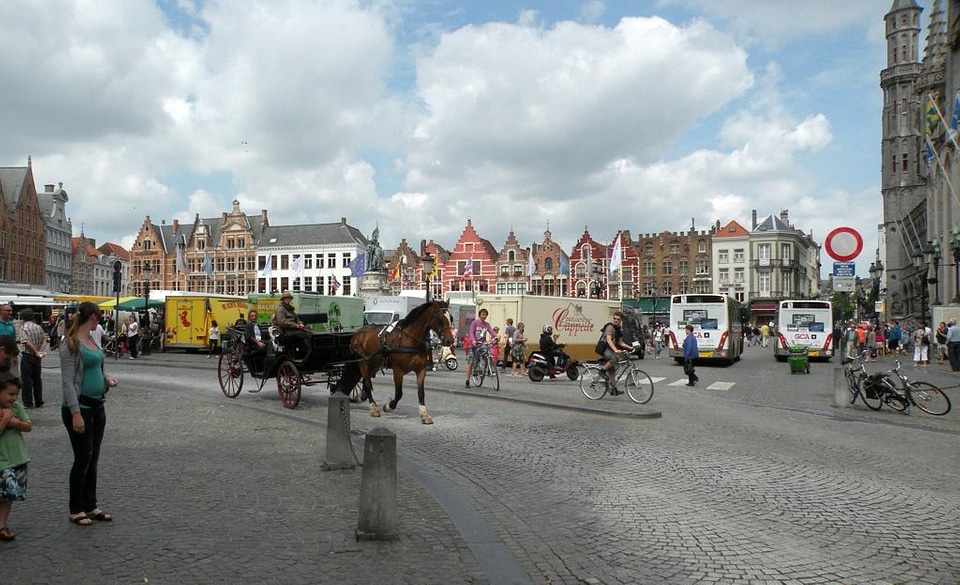 Belgique with horse carriage and streets in Brussels, Belgium