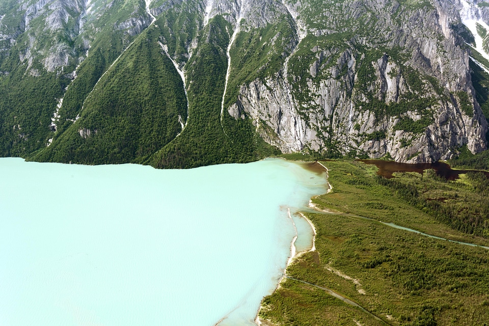 Landscape of Lake Clark against green shoreline