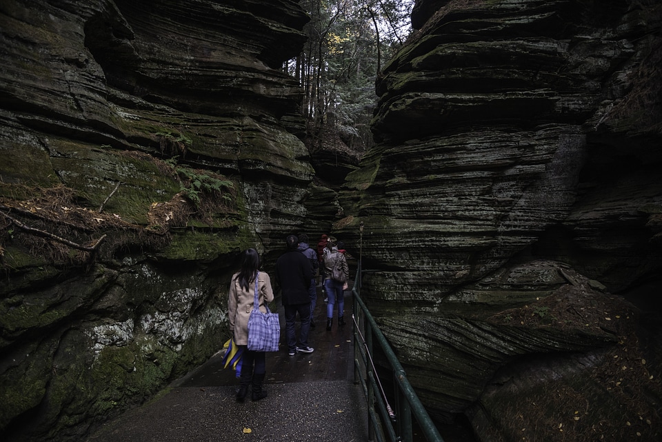 Walking between the Rock formations at Witches Gulch at Wisconsin Dells