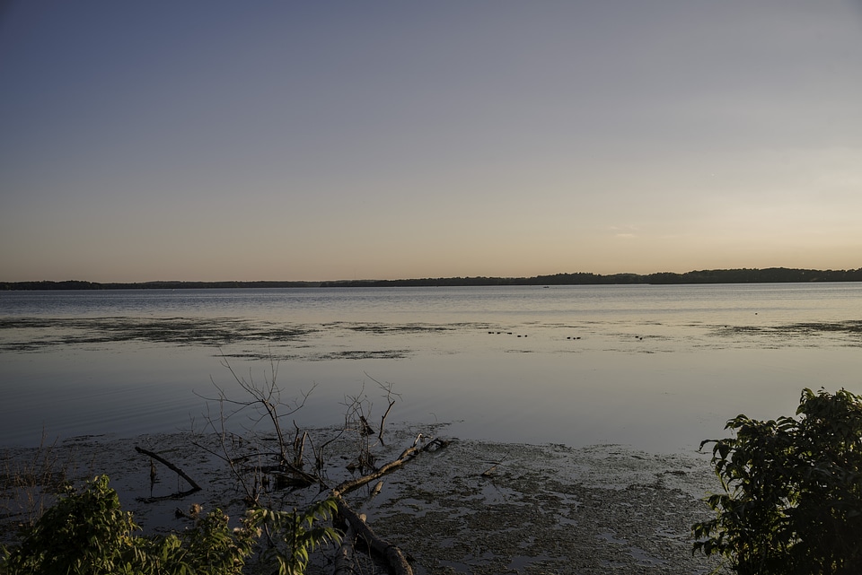 Sunset photo of the lake on the bridge
