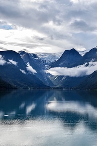 Scenic landscape with lake and landscape with clouds photo