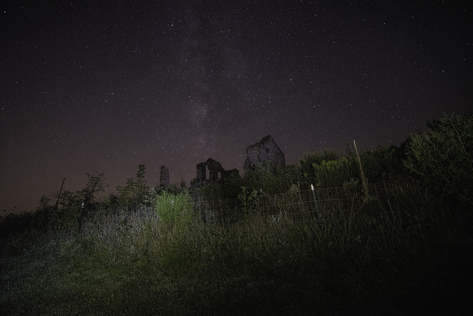Stars coming from above the old abandoned house photo