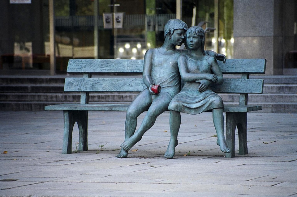 Young Boy and Girl Statue on bench