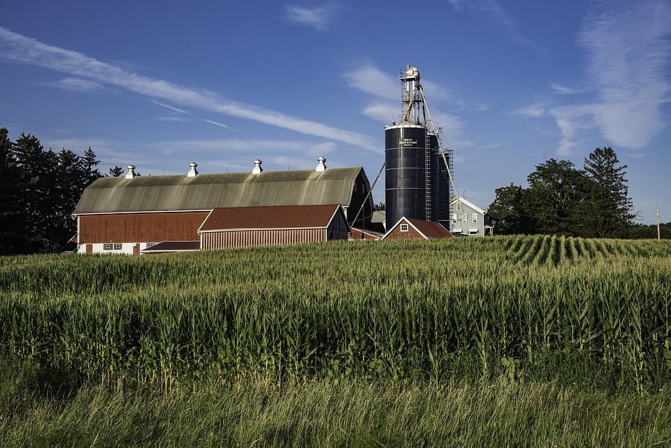 Cloud streaks over the farmhouse landscape