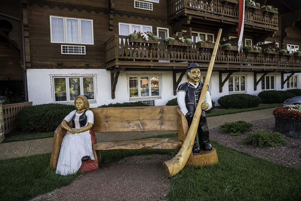 Two Statues on a bench by the hotel in New Glarus