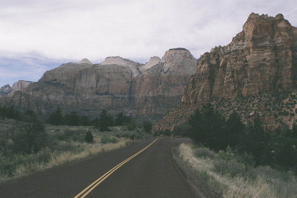 Road and rocky landscape of mountains with fog photo