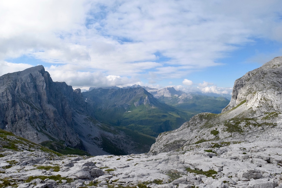 Clouds over the high mountain peaks photo