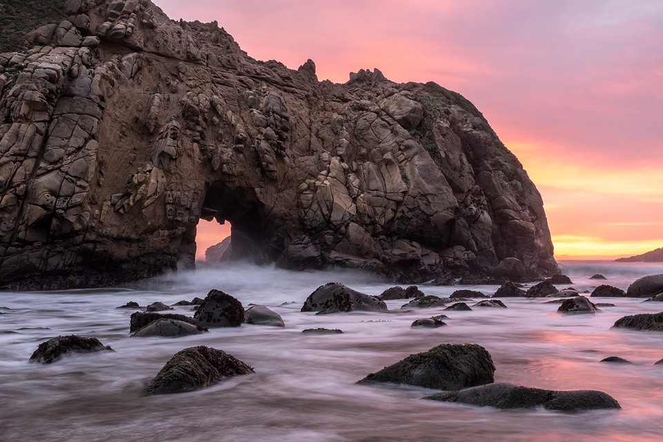 Dusk and Waves washing on the rocks at Big Sur, California