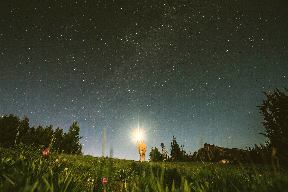 Sky with Stars with guy holding a light