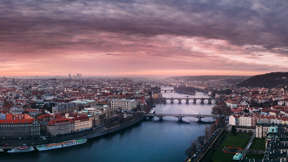 Beautiful Cityscape with a river under dusk skies in Prague, Czech Republic photo