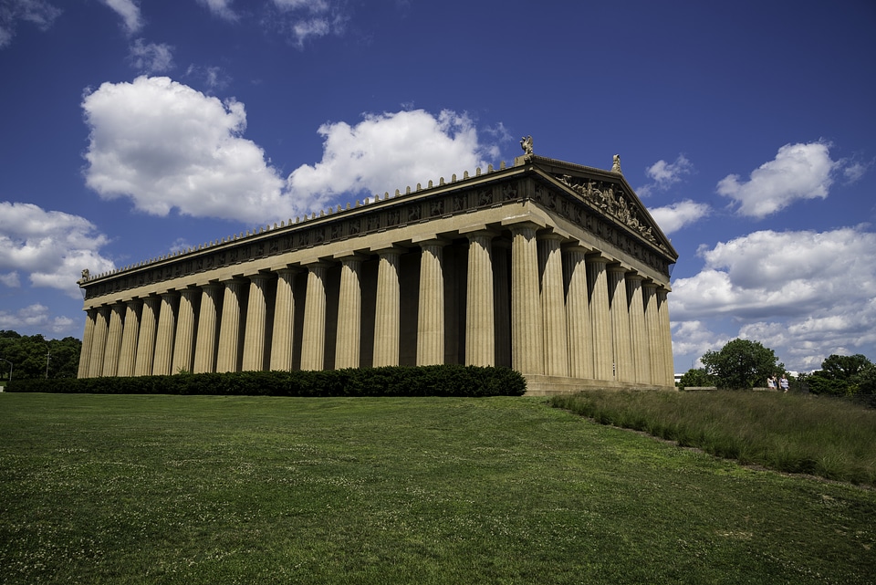 View of the Parthenon of Nashville under blue skies and clouds