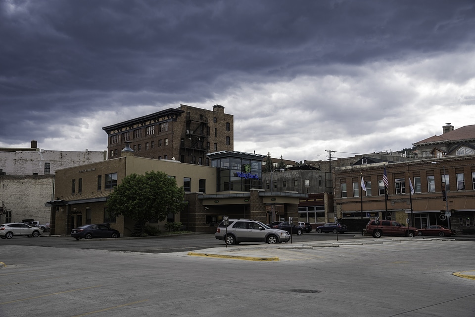 Car parked in front of downtown buildings in Helena