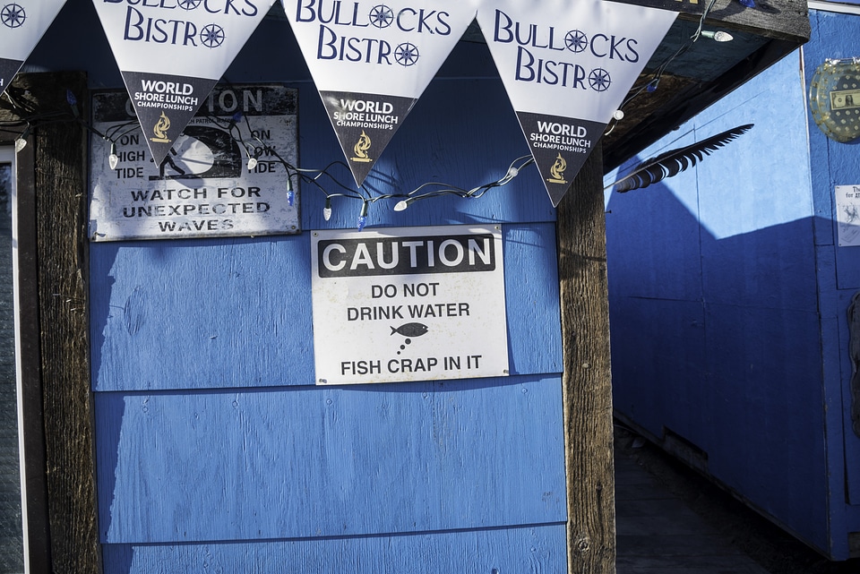 Fish crap in water sign