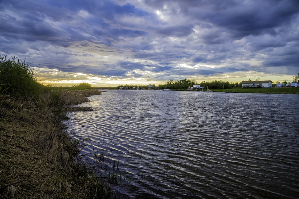 Sunset on the river under the clouds
