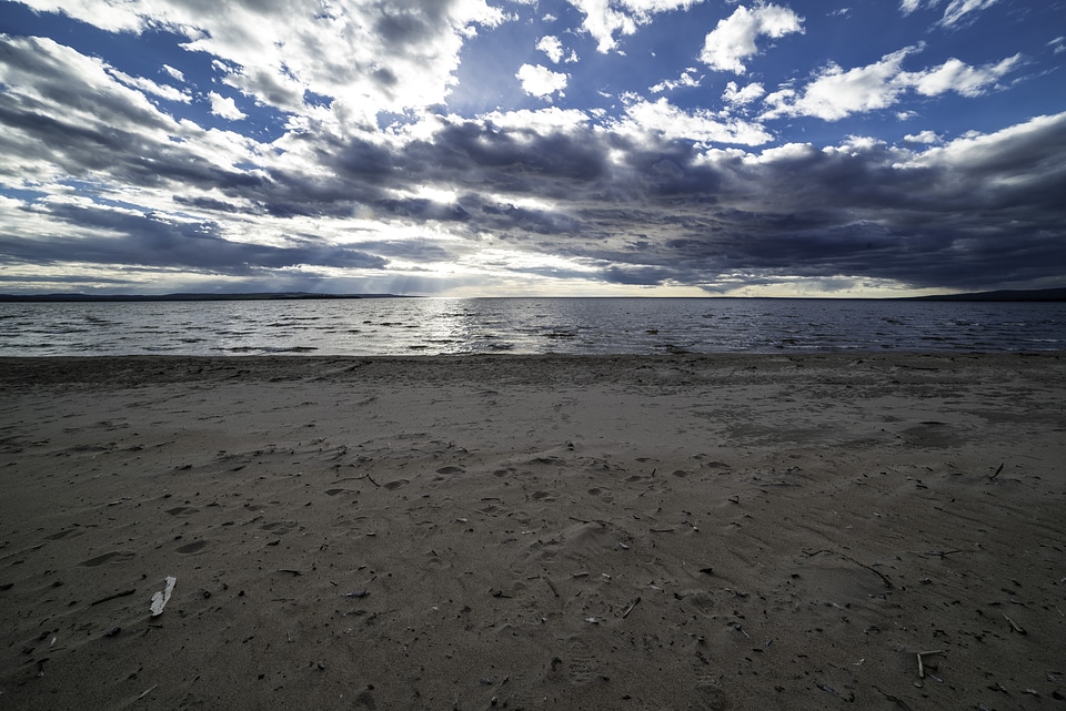 Beach and Shoreline with clouds and sky with sun