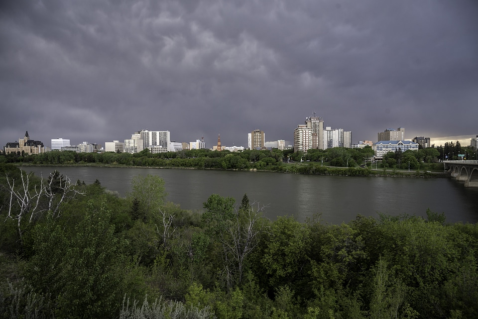 Full Skyline of Saskatoon under the clouds and skies