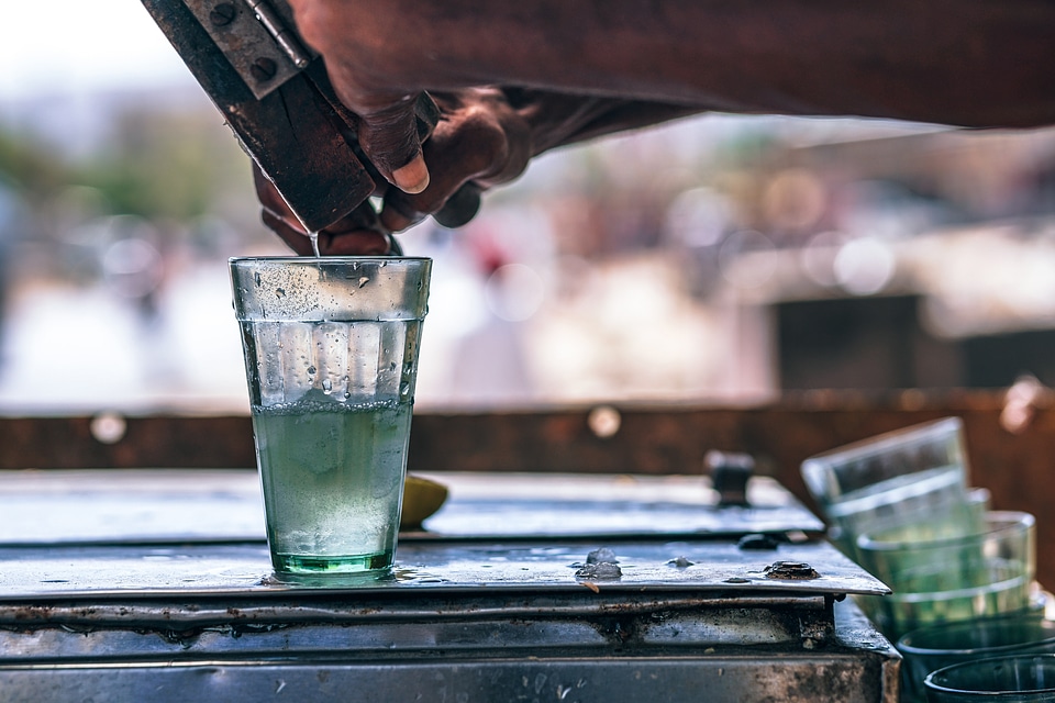 Bartender mixing a drink on a table