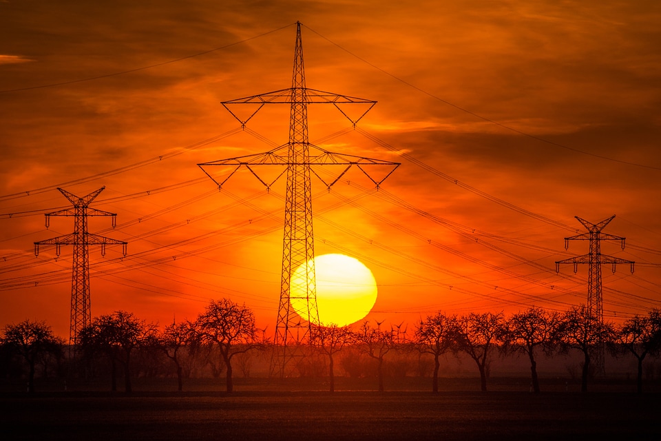 Sunset over Electricity towers and red sky photo