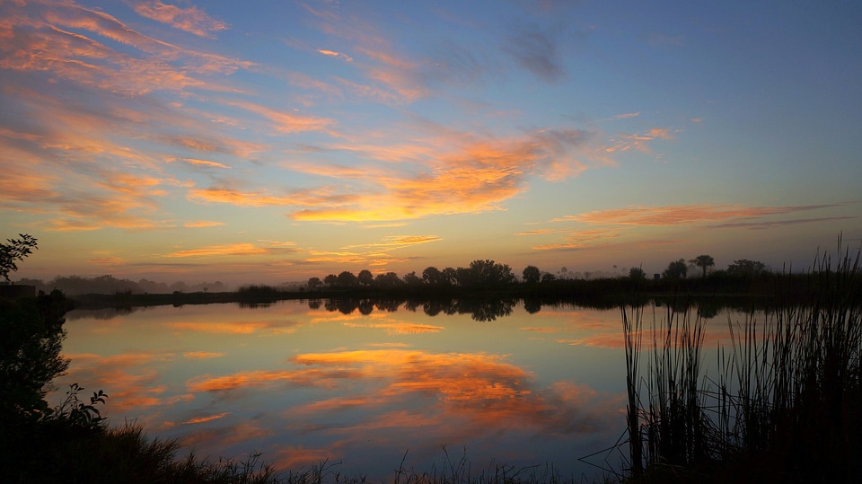 Sunset and Dusk Skies over the water at Big Cypress National Preserve photo