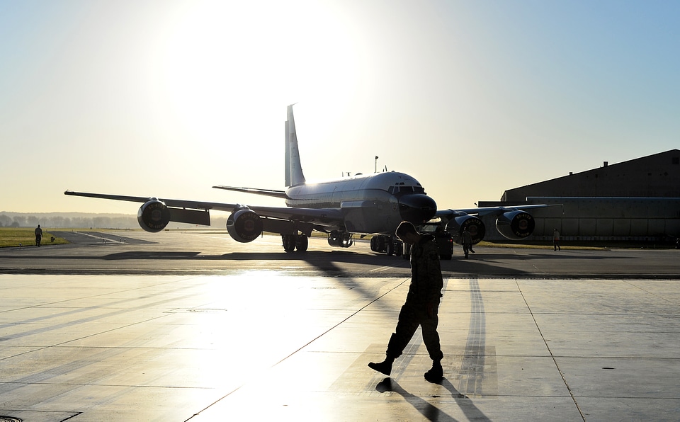 Airman and airplane at the airport or base