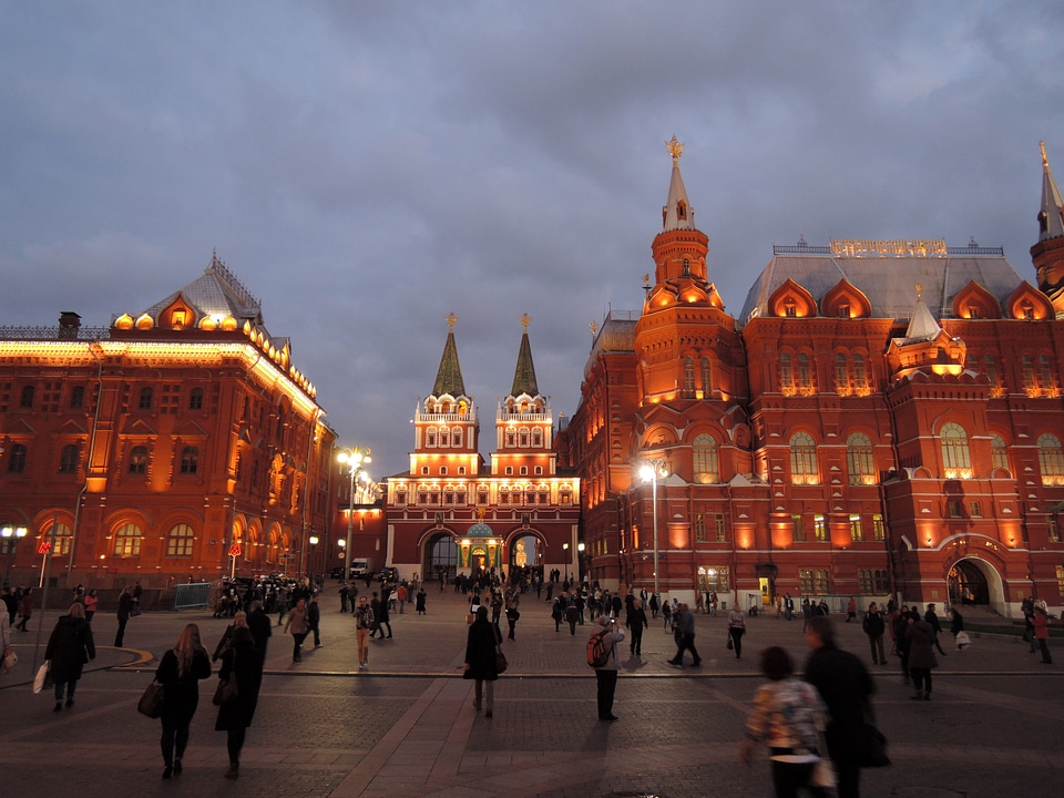People walking around the square at night in Moscow, Russia