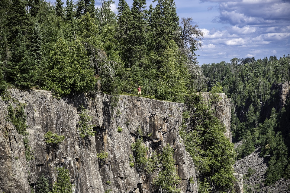 Man standing on the bluff at Ouimet Canyon Provincial Park, Ontario