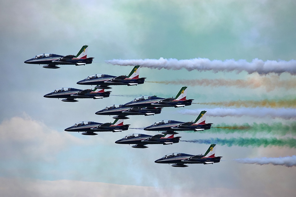 Jet Aircraft with colorful exhaust during an airshow