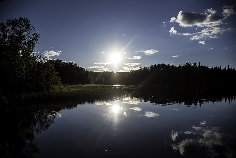 Bright Sun over Day lake in Chequamegon National Forest, Wisconsin