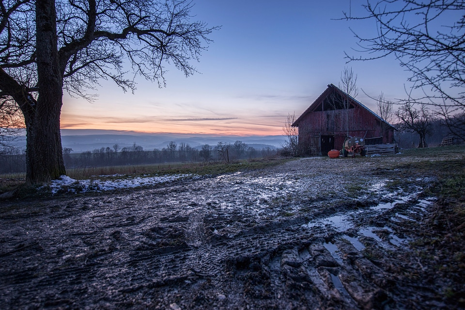 Winter landscape with small house