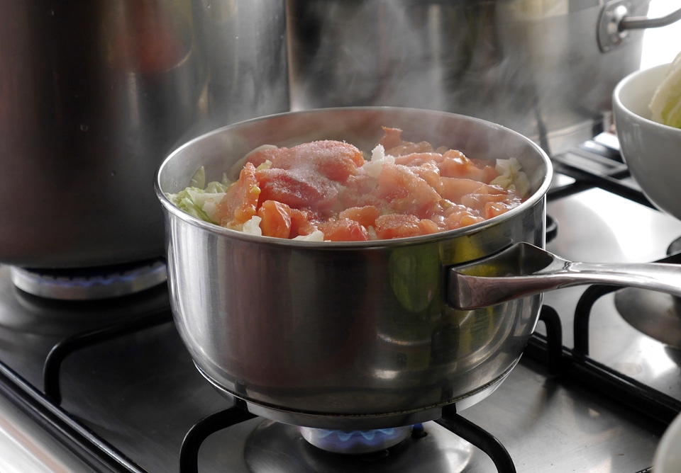 Meats cooking in a large pot