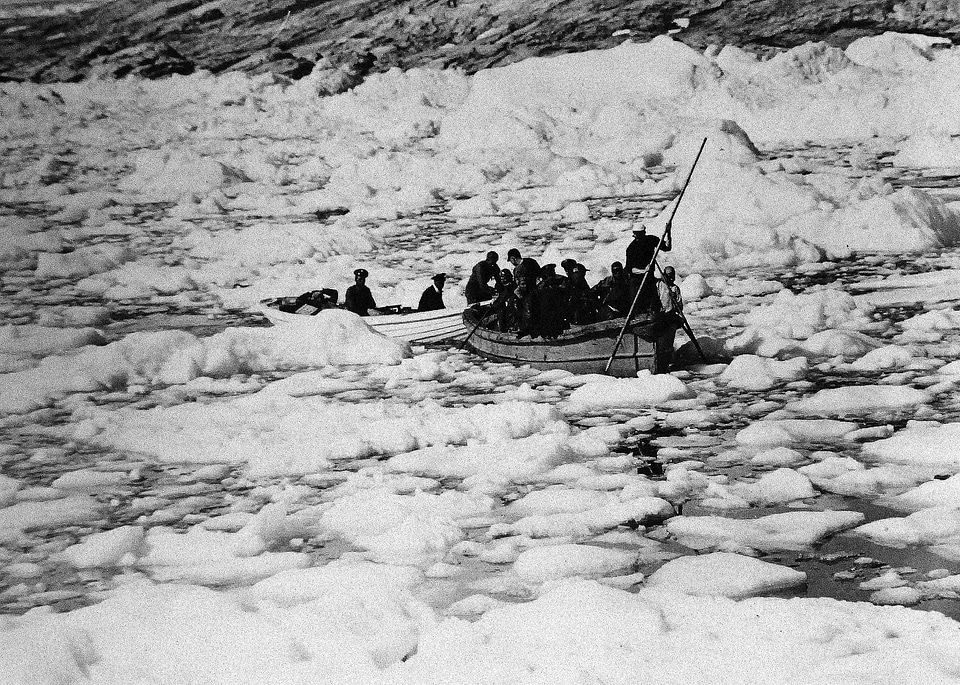 Small Boat moving through the ice