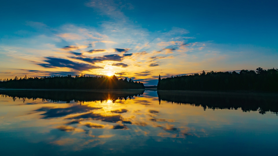 Sunset over the lake with sky and clouds photo