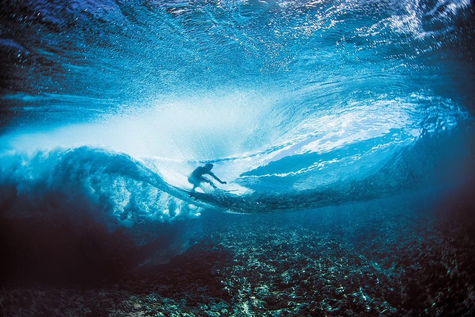 Surfer under the waves