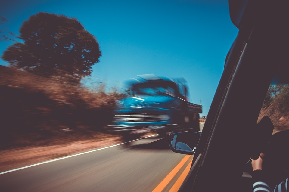 Car speeding by on the road