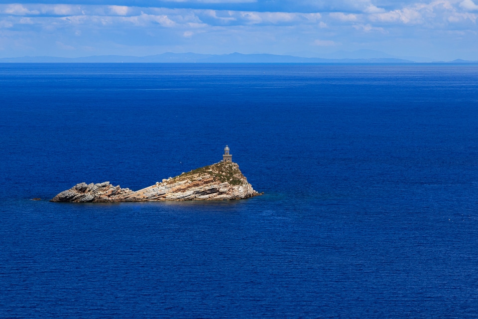 Scoglietto Lighthouse in the middle of the ocean