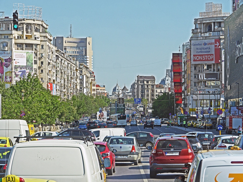 Streets, buildings, and cars in Bucharest, Romania photo